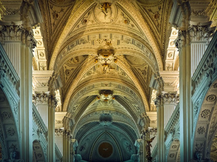 Stunning interior capturing the ornate ceiling of a historic cathedral.